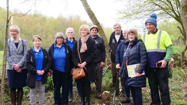 Barnsley Main volunteers stood in a wooded area on site