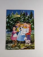 Illustration of children singing from a songbook in a snowy forest. Five kids, dressed in colorful winter clothing, stand near a lamb and a fawn. Snowflakes fall gently, and evergreen trees form a backdrop under a starry night sky.