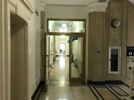 Corridor leading to Barnsley Archives showing a door held in the open position.