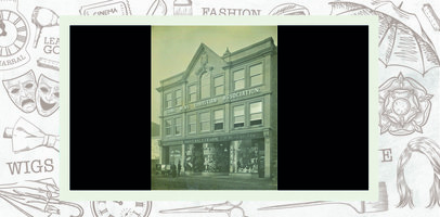 Building has Young Men's Christian Association written in capital letter individually attached to the façade above first floor windows. Three shopfronts at ground level for Holroyd, E Walker and F Hinchliffe.