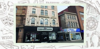 Shopfront of Leslie Frances hairdressing next to the shop of Globe Holidays, with the entrance to an alley between the two businesses..