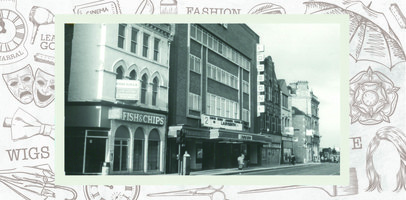 60 Eldon Street with a fish and chip sign and a 'for sale' board at first floor level. The Odeon cinema next door is showing the film Labyrinth according to the sign above the canopy.