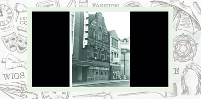 Empty shop with sign removed. Part of the Odeon sign next door is visible.