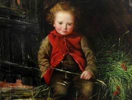 A child with curly red hair sits by a wooden structure, wearing a red vest over a brown shirt and pants. The child holds a thin stick and looks down, smiling, with grass and small red berries nearby.
