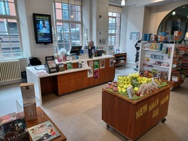 Experience Barnsley Museum Gift Shop showing reception desk at the back wall and displays of books and gifts