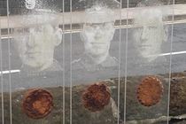 Section from the model showing images of soldiers and medals cast in plaster.